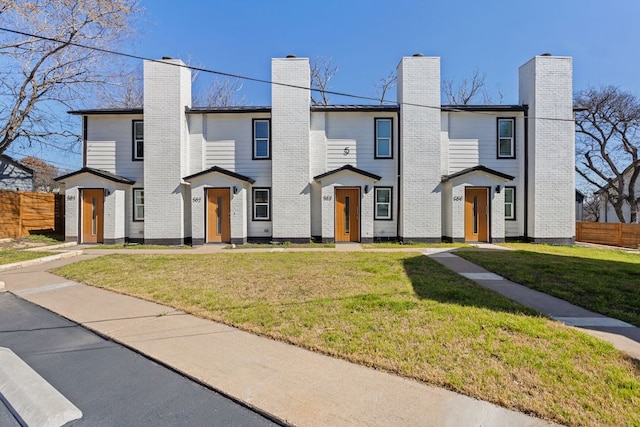 2706 Wheless Ln Unit 502, Austin, TX 78723 - view of front facade featuring a chimney
