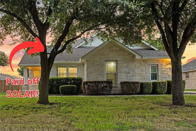 608 Timothy John Dr, Pflugerville, TX 78660 - view of front of property with stone siding, a yard, and roof with shingles