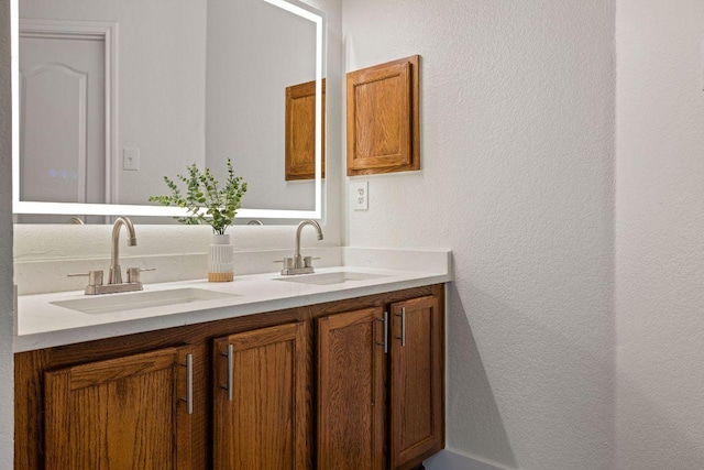 608 Timothy John Dr, Pflugerville, TX 78660 - bathroom with double vanity and a textured wall