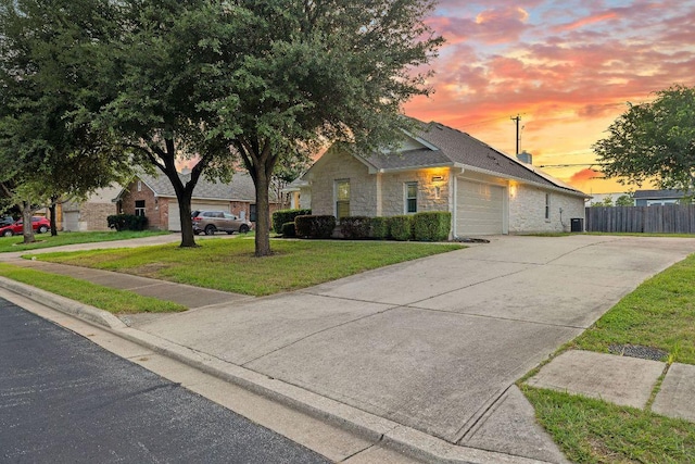 608 Timothy John Dr, Pflugerville, TX 78660 - view of front of house featuring an attached garage, stone siding, and concrete driveway