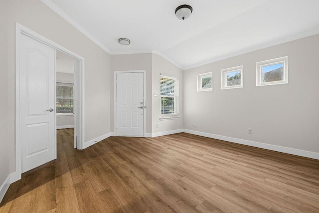 608 Timothy John Dr, Pflugerville, TX 78660 - unfurnished room with crown molding, plenty of natural light, wood finished floors, and lofted ceiling
