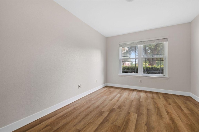 608 Timothy John Dr, Pflugerville, TX 78660 - empty room featuring wood finished floors and lofted ceiling