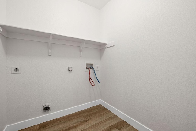 608 Timothy John Dr, Pflugerville, TX 78660 - laundry area featuring gas dryer hookup, wood finished floors, washer hookup, and hookup for an electric dryer