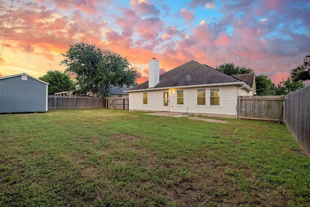 608 Timothy John Dr, Pflugerville, TX 78660 - rear view of house with a fenced backyard, a chimney, a shed, and a patio