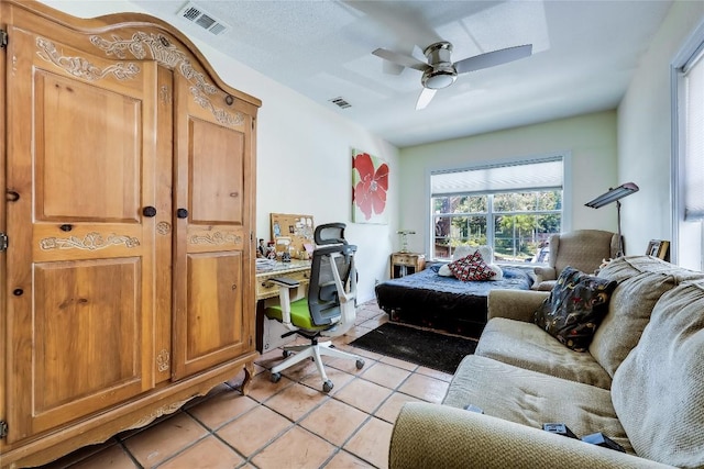 1506 Alguno Rd, Austin, TX 78757 - bedroom with a desk, light tile patterned floors, and ceiling fan