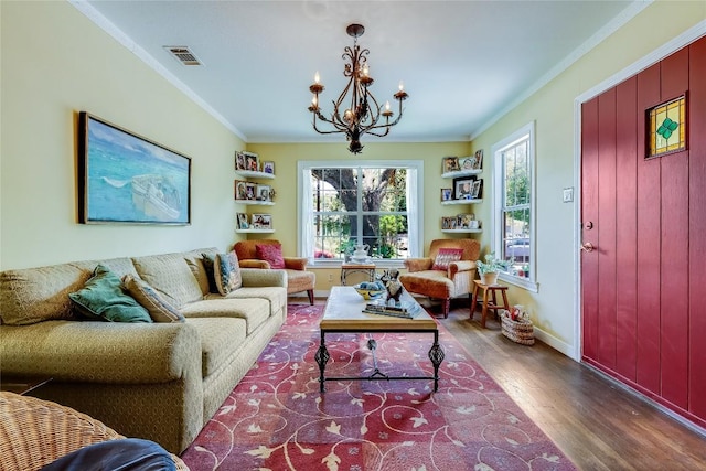 1506 Alguno Rd, Austin, TX 78757 - living room with wood finished floors, a chandelier, and ornamental molding