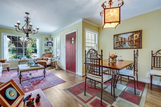 1506 Alguno Rd, Austin, TX 78757 - dining space featuring a chandelier, crown molding, and wood finished floors