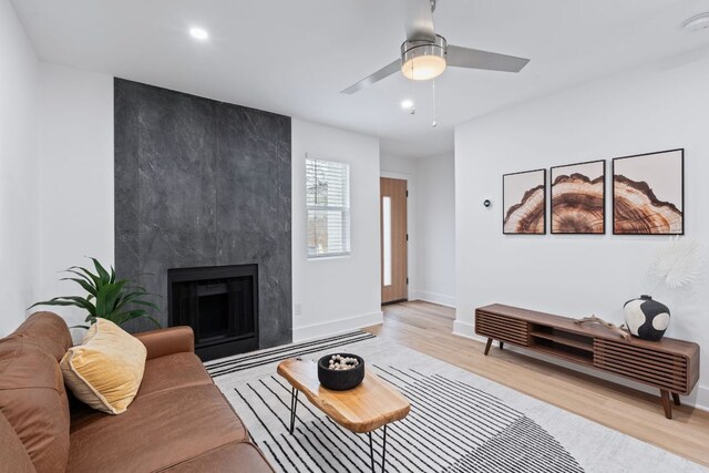 2706 Wheless Ln Bldg 5, Austin, TX 78723 - living area with wood finished floors, ceiling fan, recessed lighting, and a high end fireplace
