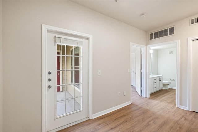 2320 Gracy Farms Ln Unit 323, Austin, TX 78758 - entryway with light wood finished floors and baseboards