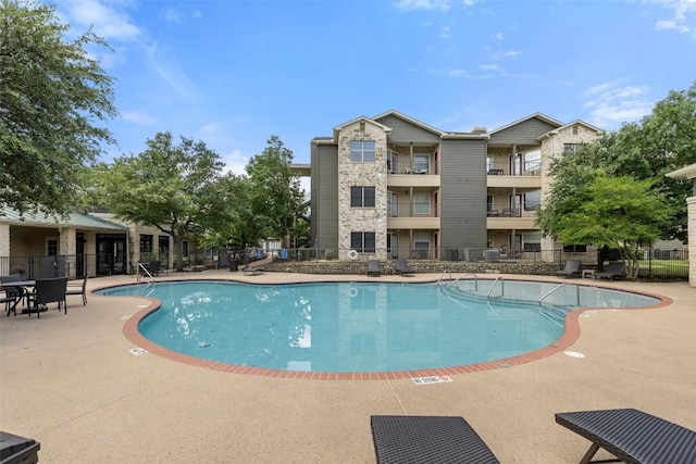 2320 Gracy Farms Ln Unit 323, Austin, TX 78758 - community pool featuring a patio