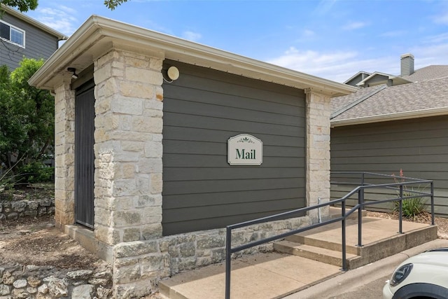 2320 Gracy Farms Ln Unit 323, Austin, TX 78758 - doorway to property with stone siding