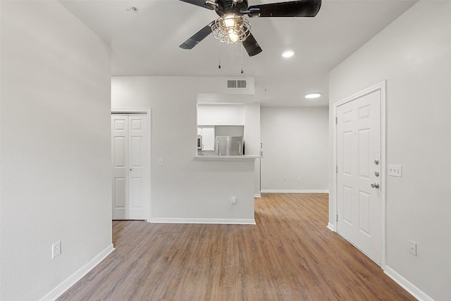 2320 Gracy Farms Ln Unit 323, Austin, TX 78758 - unfurnished living room with ceiling fan, wood finished floors, and recessed lighting