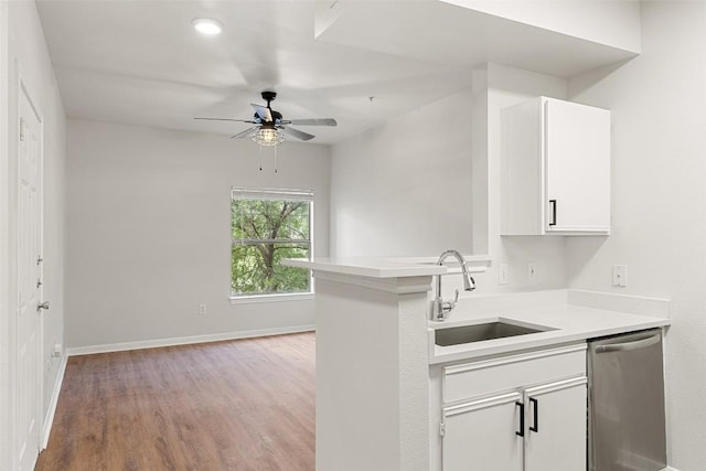 2320 Gracy Farms Ln Unit 323, Austin, TX 78758 - kitchen featuring dishwasher, light wood-style flooring, light countertops, a ceiling fan, and white cabinetry