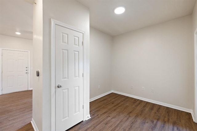2320 Gracy Farms Ln Unit 323, Austin, TX 78758 - unfurnished room featuring dark wood-style flooring and recessed lighting