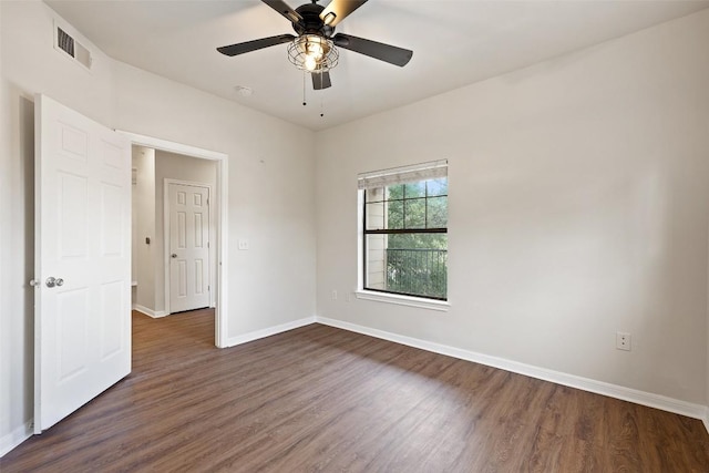 2320 Gracy Farms Ln Unit 323, Austin, TX 78758 - unfurnished bedroom featuring dark wood-style floors and ceiling fan