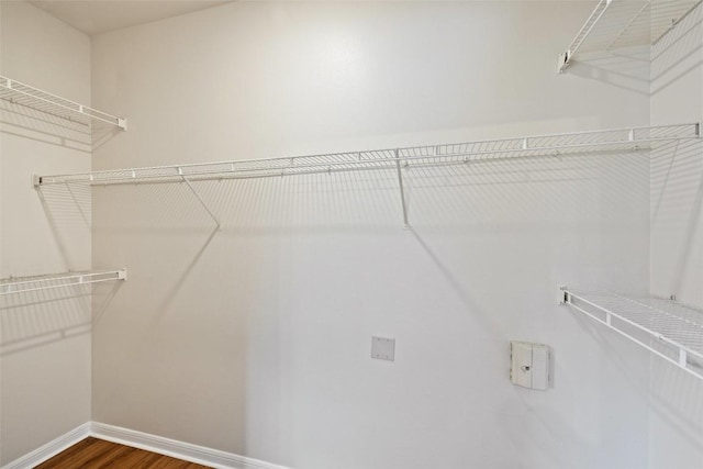 2320 Gracy Farms Ln Unit 323, Austin, TX 78758 - walk in closet featuring dark wood-style flooring