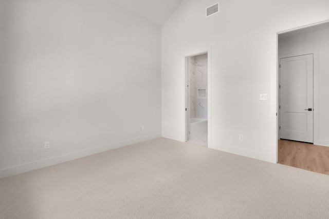 209 Burnet Oaks Dr, Burnet, TX 78611 - unfurnished bedroom with carpet, vaulted ceiling, and ensuite bath