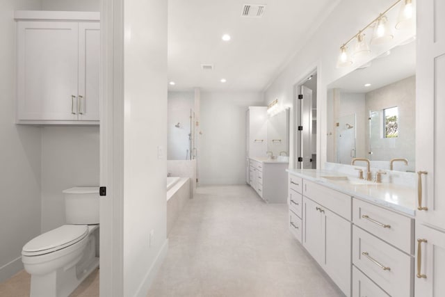 209 Burnet Oaks Dr, Burnet, TX 78611 - bathroom featuring a stall shower, two vanities, a garden tub, and recessed lighting