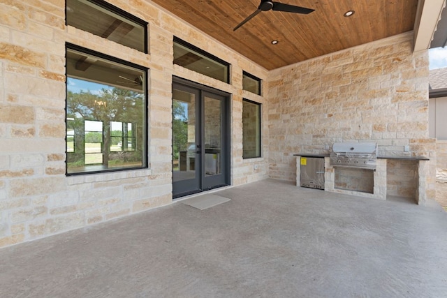 209 Burnet Oaks Dr, Burnet, TX 78611 - view of patio with an outdoor kitchen and a ceiling fan