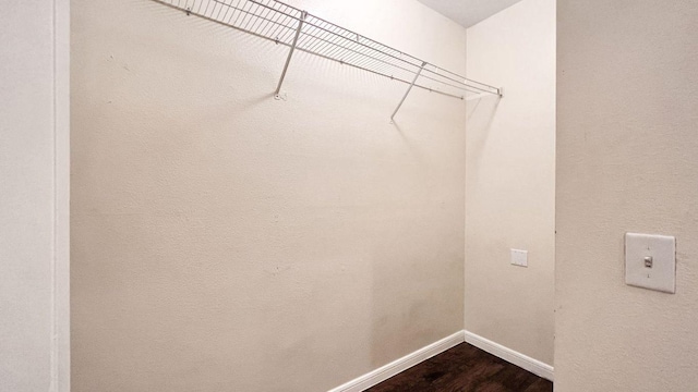 2320 Gracy Farms Ln Unit 1432, Austin, TX 78758 - laundry area with baseboards and dark wood-style floors