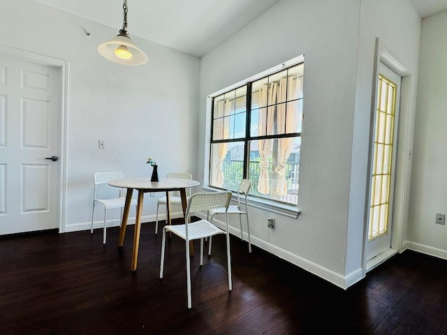 2320 Gracy Farms Ln Unit 1432, Austin, TX 78758 - dining room featuring baseboards and dark wood-type flooring
