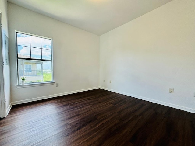 2320 Gracy Farms Ln Unit 1432, Austin, TX 78758 - empty room featuring dark wood-style floors and baseboards