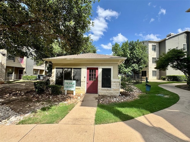 2320 Gracy Farms Ln Unit 1432, Austin, TX 78758 - view of front facade featuring stone siding