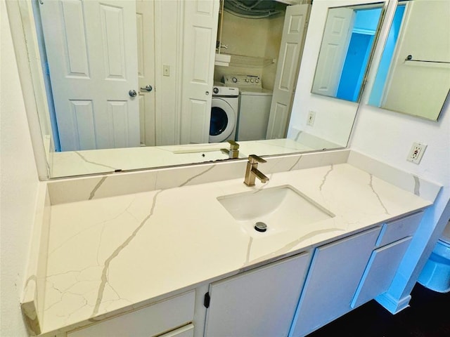 2320 Gracy Farms Ln Unit 1432, Austin, TX 78758 - bathroom featuring washer / dryer and vanity