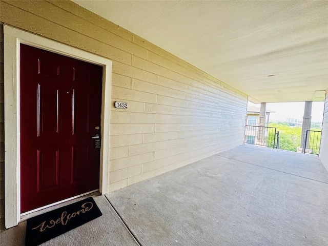 2320 Gracy Farms Ln Unit 1432, Austin, TX 78758 - doorway to property featuring a porch