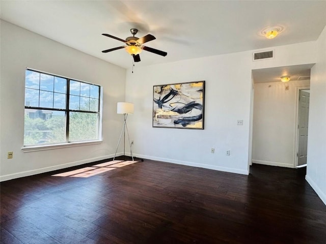 2320 Gracy Farms Ln Unit 1432, Austin, TX 78758 - empty room featuring dark wood-style flooring and a ceiling fan