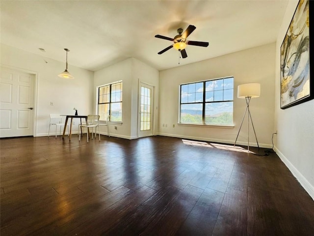 2320 Gracy Farms Ln Unit 1432, Austin, TX 78758 - unfurnished living room featuring dark wood-type flooring and ceiling fan
