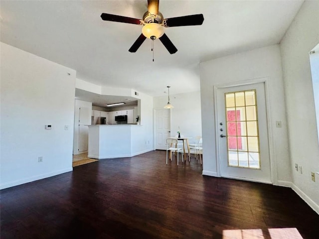 2320 Gracy Farms Ln Unit 1432, Austin, TX 78758 - unfurnished living room featuring wood finished floors and a ceiling fan