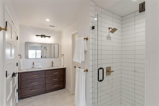 18924 Peckham Dr, Point Venture, TX 78645 - bathroom featuring a shower stall, double vanity, and recessed lighting