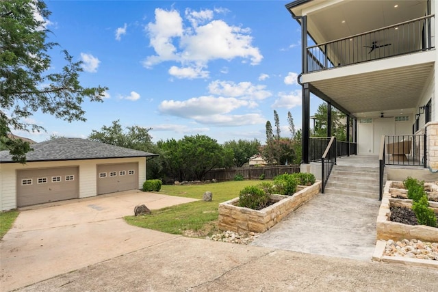 18924 Peckham Dr, Point Venture, TX 78645 - view of yard featuring an outdoor structure and a detached garage