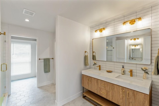 18924 Peckham Dr, Point Venture, TX 78645 - full bath featuring double vanity, decorative backsplash, an enclosed shower, tile patterned flooring, and recessed lighting