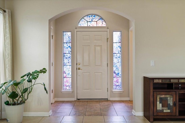 327 Lakemont Dr, Hutto, TX 78634 - foyer featuring arched walkways and tile patterned flooring