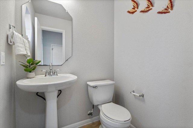 327 Lakemont Dr, Hutto, TX 78634 - bathroom with toilet and baseboards