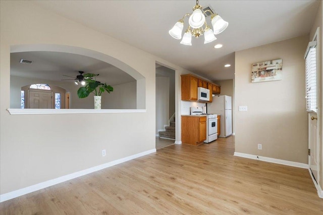 327 Lakemont Dr, Hutto, TX 78634 - unfurnished living room featuring light wood-type flooring, ceiling fan, stairs, plenty of natural light, and recessed lighting