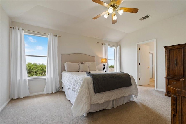 327 Lakemont Dr, Hutto, TX 78634 - bedroom featuring light colored carpet, vaulted ceiling, and ceiling fan