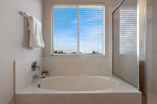 327 Lakemont Dr, Hutto, TX 78634 - full bath with a garden tub and a stall shower