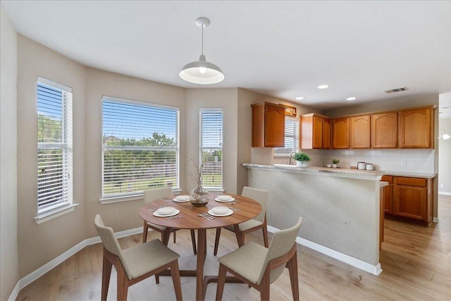 327 Lakemont Dr, Hutto, TX 78634 - dining space featuring light wood-type flooring, plenty of natural light, and recessed lighting