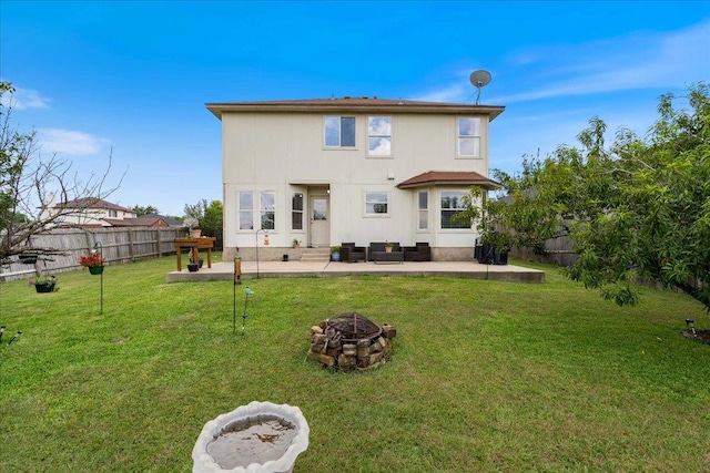 327 Lakemont Dr, Hutto, TX 78634 - back of house with a patio, a fire pit, and a fenced backyard