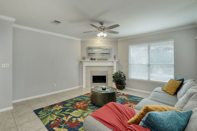 12421 Black Hills Dr, Austin, TX 78748 - tiled living area with ornamental molding, a ceiling fan, and a tiled fireplace