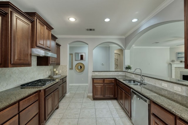 12421 Black Hills Dr, Austin, TX 78748 - kitchen with appliances with stainless steel finishes, under cabinet range hood, dark stone countertops, backsplash, and recessed lighting