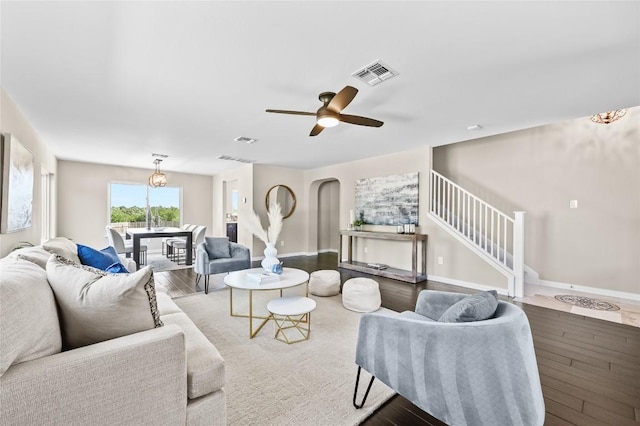 2512 Regal Park Ln, Austin, TX 78748 - living area featuring wood finished floors, stairway, arched walkways, and ceiling fan