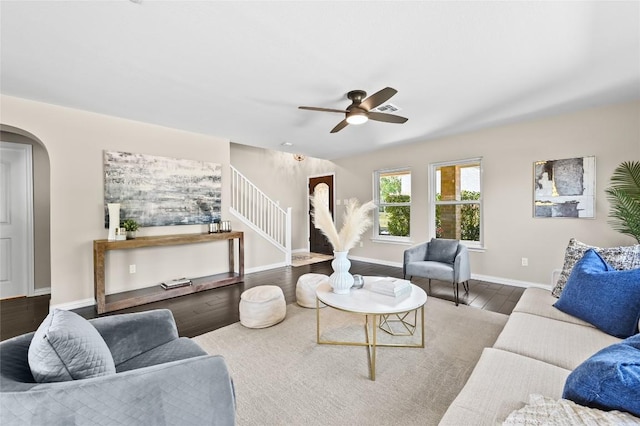 2512 Regal Park Ln, Austin, TX 78748 - living area featuring stairway, arched walkways, ceiling fan, and wood finished floors