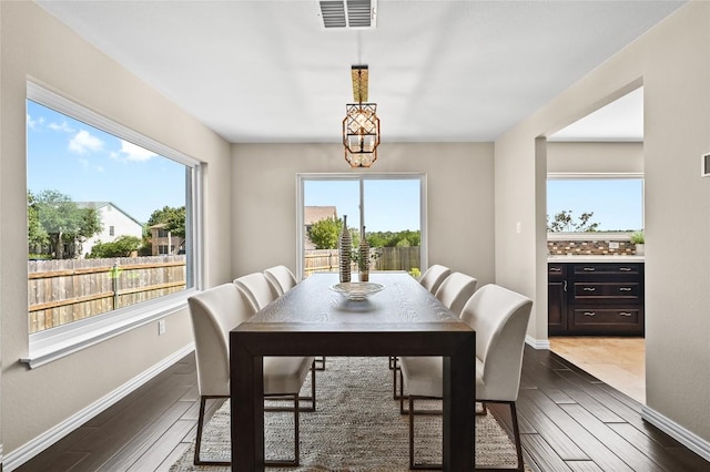 2512 Regal Park Ln, Austin, TX 78748 - dining room featuring plenty of natural light and dark wood-style flooring