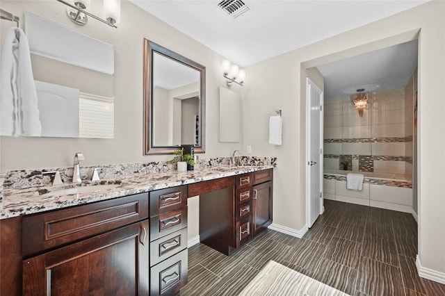 2512 Regal Park Ln, Austin, TX 78748 - full bathroom with double vanity and a tile shower