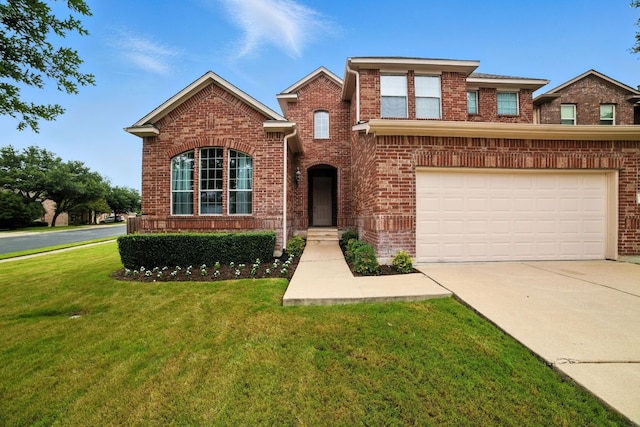 3801 Poppy Hills Cv, Round Rock, TX 78664 - traditional-style house featuring a front yard, driveway, a garage, and brick siding