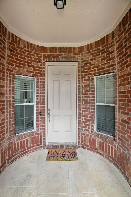 3801 Poppy Hills Cv, Round Rock, TX 78664 - property entrance featuring brick siding